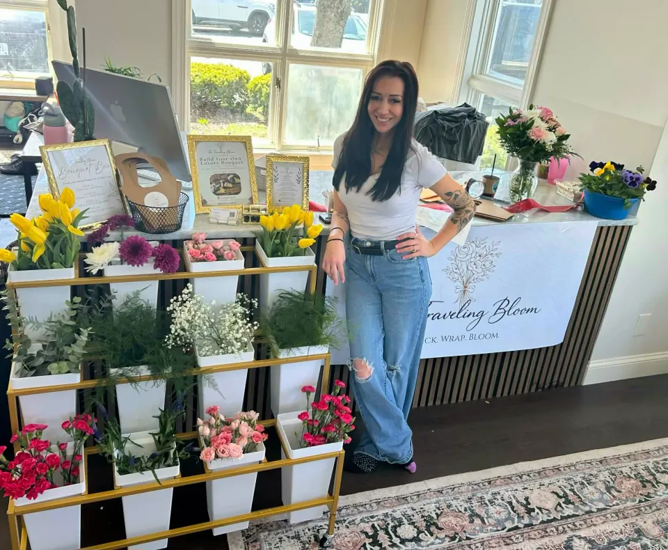 Alaina from The Traveling Bloom with the bloom cart at an event