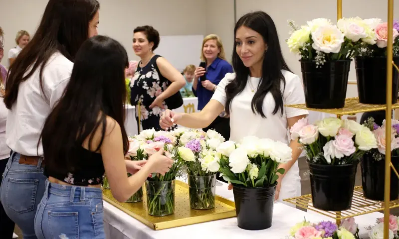 Guests building bouquets at a bouquet bar experience