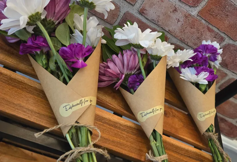 Wrapped mini bouquets at a bouquet bar